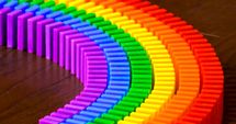 Dominoes make a rainbow trail